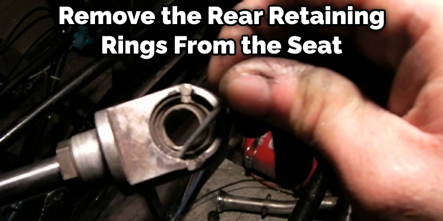 Remove the Rear Retaining Rings From the Seat