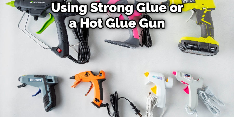 Using Strong Glue or a Hot Glue Gun