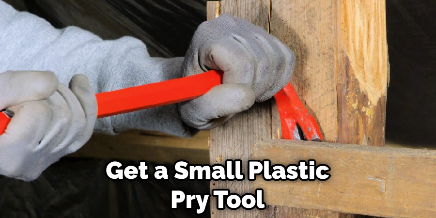 Get a Small Plastic Pry Tool