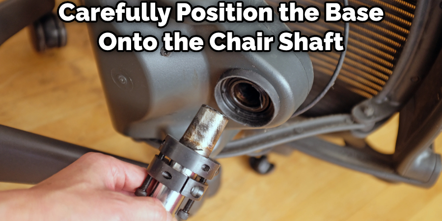 Carefully Position the Base Onto the Chair Shaft